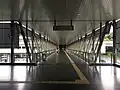 View of the pedestrian link bridge between the entrance A and the station.