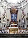Presbytery with main altar, flanked by Saints Anne and Teresa