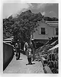 A sergeant walking a paved path in Hell's Gate, in the 1940s