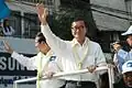 CNRP President Sam Rainsy and Vice President Kem Sokha wave to protesters during a demonstration in December 2013.