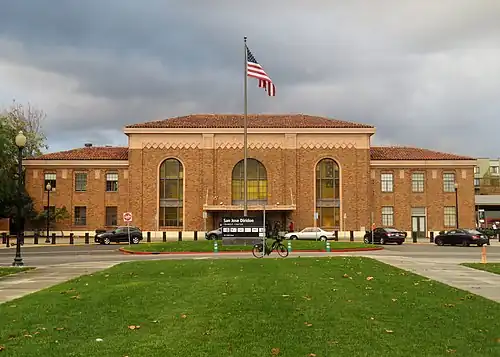 A large brick Mission-style railroad station building
