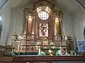 Church sanctuary featuring its main altarpiece