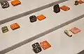 Seals on display at the Saruq Al Hadid Archaeology Museum originating from Mesopotamia, Bahrain and Egypt.