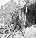 Infantryman of the Stormont, Dundas and Glengarry Highlanders armed with a German Schmeisser MP 40