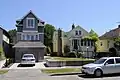 The Northwest Contemporary house at 4142 20th Avenue SW in the Pigeon Point neighborhood (left) was built in 2007 in the space that was formerly the garage of neighboring 4146 20th Avenue SW (right).[74]