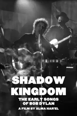 A black-and-white still of Bob Dylan singing into a microphone and playing guitar with the title of the movie over it
