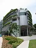 An exterior shot of a building with a metal-and-glass exterior.