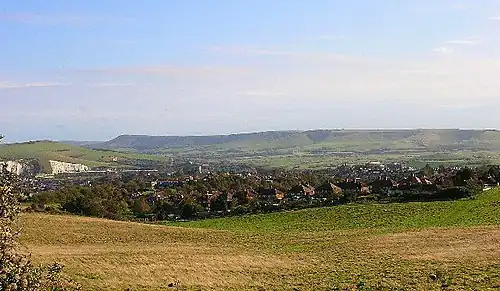 Modern photograph of the site of the Battle of Lewes 1264. The battle was fought between Simon de Montfort and Henry III in the field in the foreground with the former being victorious. Lewes castle and Southerham chalk pits to the left and Beddingham Hill behind it with the town of Lewes.