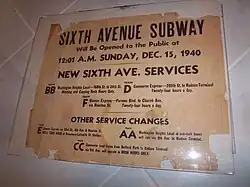 An old sign stating "Sixth Avenue Subway Will be Opened to the Public at 12:01 A.M. Sunday, December 15, 1940. There are service announcements for other subway lines as well.
