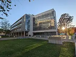 Pharmceutical Sciences building with "Skaggs School of Pharmacy and Pharmaceutical Sciences" sign in front