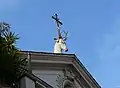 The stag-and-cross symbol of