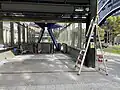 Near-completed station entrance facing south down the royal parade, next to the University of Melbourne Medical Building, May 2024