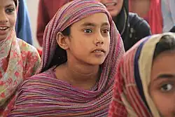 A girl wearing Soossi fabric dress