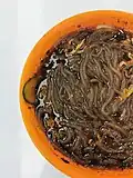 Sì chuān suān là fěn (hot and sour noodles) made with fensi or hongshufen