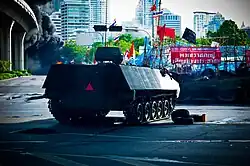 A Type 85 AFV prepares to assault the Red Shirt barricade at Sala Daeng intersection, 19 May 2010