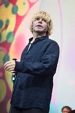 Burgess performing in 2024