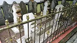 The tomb of Syed Omar Aljunied, with some older tombstones exhibited behind it.