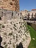 The tower and the moat separating it from the city