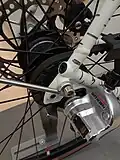 Trek TAB Belt Drive rear sprocket side view with 3-speed hub. The connection point between chainstay and seatstay necessary to insert belt drive is visible.