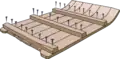 Placing the "headers" (cabezales) with large iron nails