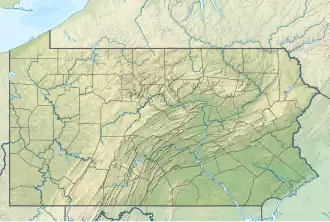 A map of the State of Pennsylvania with red dot marking the location of the park in southern central part of the state.