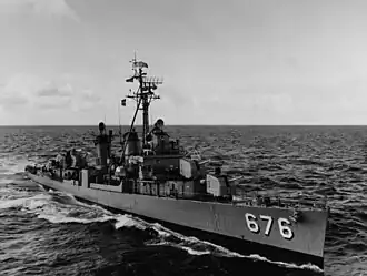 USS Marshall (DD-676), pulling alongside USS Coral Sea (CVA-43), during refueling exercises off the California coast, 7 March 1963.