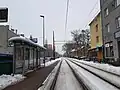 Tram tracks running across the street.