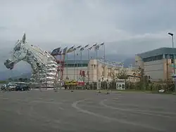 A float being towed out of the Cittadella del Carnevale.