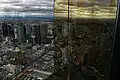 Looking north-east over Melbourne CBD from the observation deck, with reflections in the tower's gold plated windows