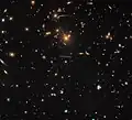 Warped and distorted around SDSS J1050+0017.[52]