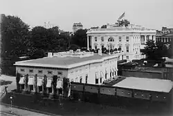 The original West Wing and tennis court, c. 1903.