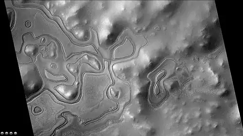 Layers just outside the rim of South crater in the form of "Swiss cheese," as seen by CTX camera. Note: this is an enlargement of a previous image of east side of South crater.
