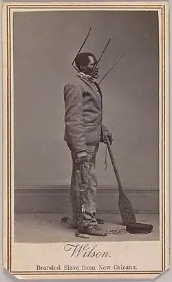 Wilson Chinn, a branded slave from Louisiana, also exhibiting instruments of torture used to punish slaves
