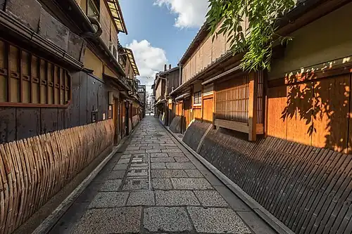 Dwellings with sudare in the street leading to the Gion Tatsumi Bridge