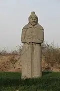 Song tomb guardian wearing a winged helmet, mountain pattern coif and lamellar armor.
